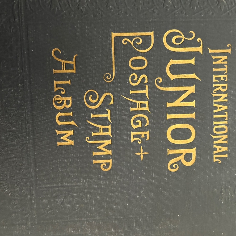 International Black and Gold lettered Vintage 1939 stamp album loaded w/stamps